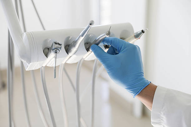 Professional Tooth Extraction technician working in Plano, KY